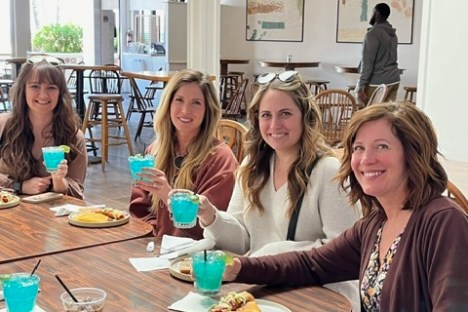 a group of people sitting at a table